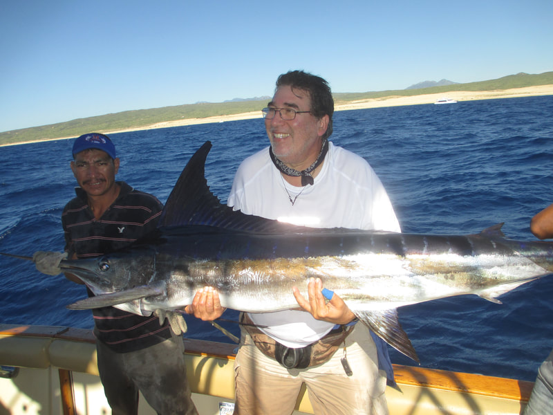 Another happy angler releases a Striped Marlin on Fiesta Sportfishing Cabo San Lucas Charter 40 ft "El Dorado VII"