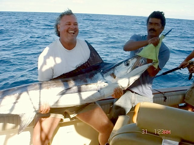 A happy angler with a World Class Striped Marlin he released on a Fiesta Sportfishing annual Guided Cabo Trip.